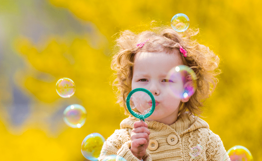 Girl blowing bubbles