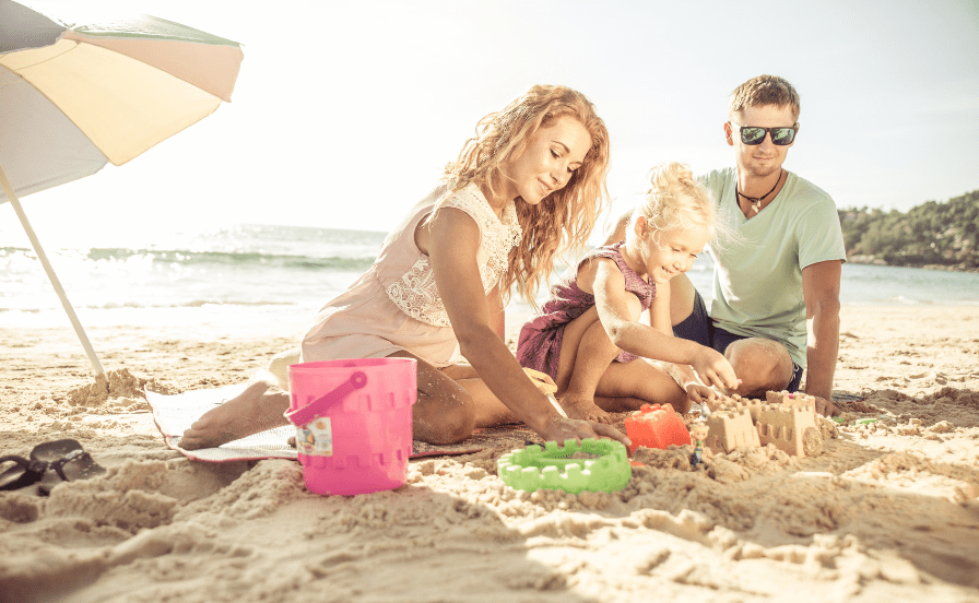 Photographing Toddlers family building sandcastle